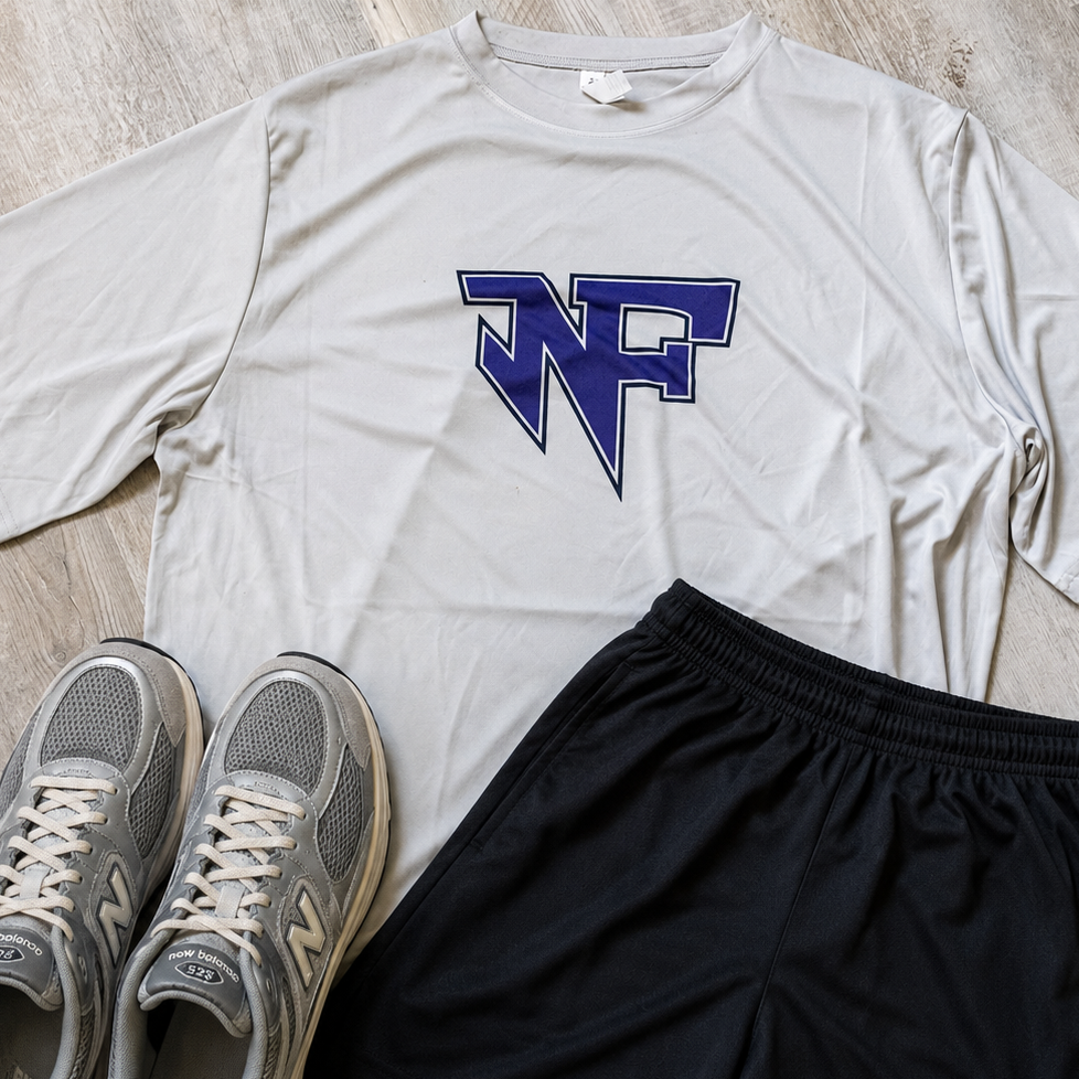A flat-lay outfit consisting of a white short-sleeve athletic T-shirt with a blue 'NF' logo, black athletic shorts with a matching blue 'NF' logo, and a pair of gray New Balance sneakers on a light wood floor.