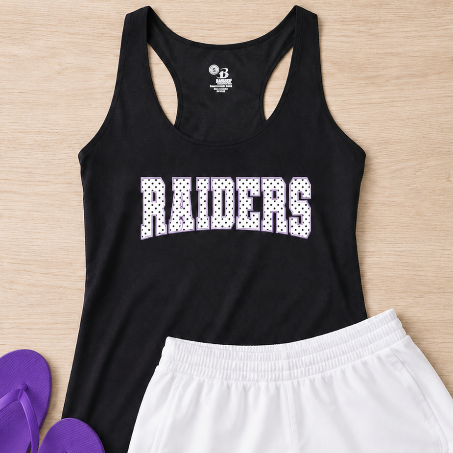 A flat-lay of a black racerback tank top with 'RIDERS' printed in white across the chest, paired with white athletic shorts and purple flip-flops on a light wood background.