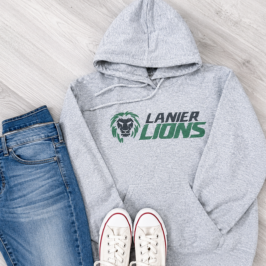 A styled flat-lay of a heather gray hoodie with a 'LANIER LIONS' graphic, paired with blue jeans and white sneakers on a light wood floor.