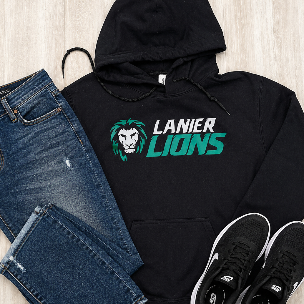 A black hoodie with a 'LANIER LIONS' graphic is styled in a flat lay with blue jeans and black sneakers on a light wood background.